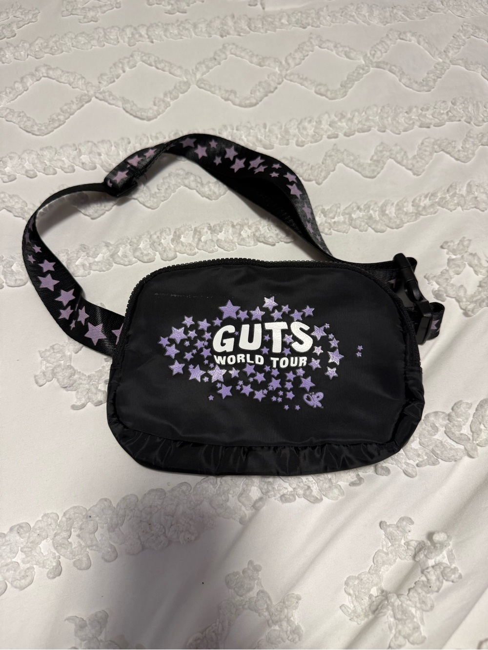 Olivia Rodrigo’s GUTS World Tour Black Crossbody Bag with Purple Stars